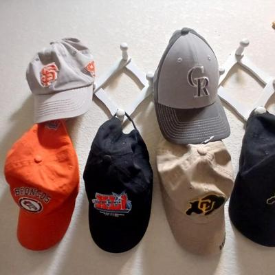 6 Sports Team Baseball Caps with wooden holder