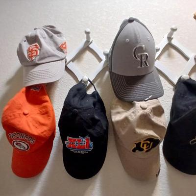 6 Sports Team Baseball Caps with wooden holder