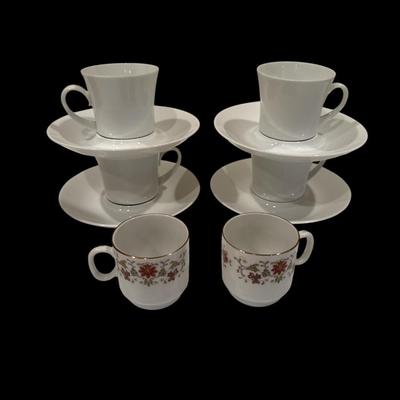 Four porcelain teacups with saucers Two demitasse cups
