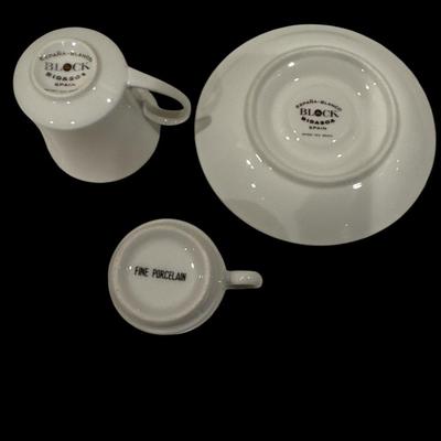 Four porcelain teacups with saucers Two demitasse cups