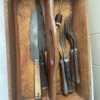 Vintage silverware tray with a few vintage knives and forks