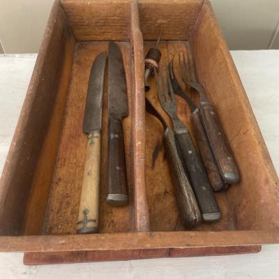 Vintage silverware tray with a few vintage knives and forks