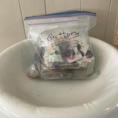 Wash basin and bag of buttons