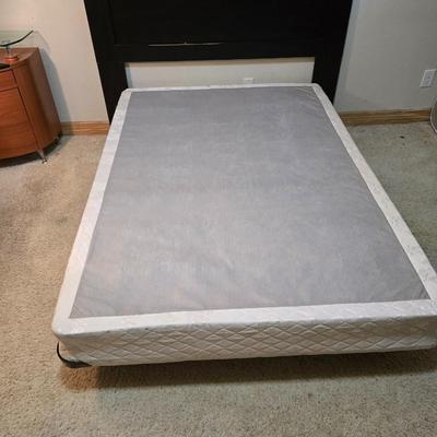 Full sized bed with wooden Purdue headboard with mattress and boxsprings and bedding