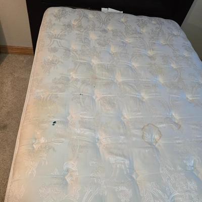 Full sized bed with wooden Purdue headboard with mattress and boxsprings and bedding