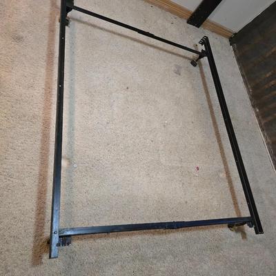 Full sized bed with wooden Purdue headboard with mattress and boxsprings and bedding