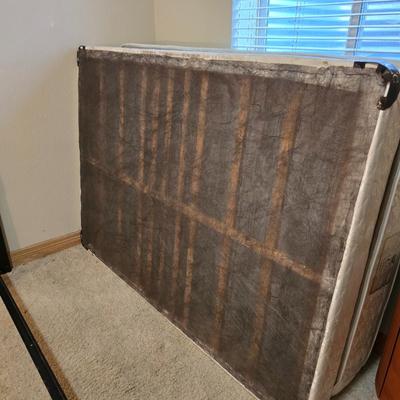 Full sized bed with wooden Purdue headboard with mattress and boxsprings and bedding