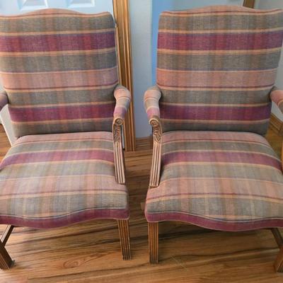 Pair of Upholstered Accent Chairs with Carved Wood Arms & Floral Pillows