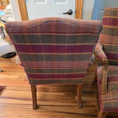 Pair of Upholstered Accent Chairs with Carved Wood Arms & Floral Pillows