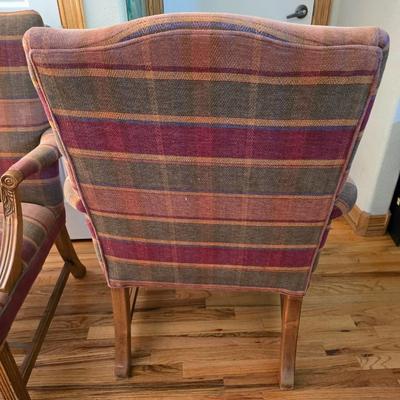 Pair of Upholstered Accent Chairs with Carved Wood Arms & Floral Pillows