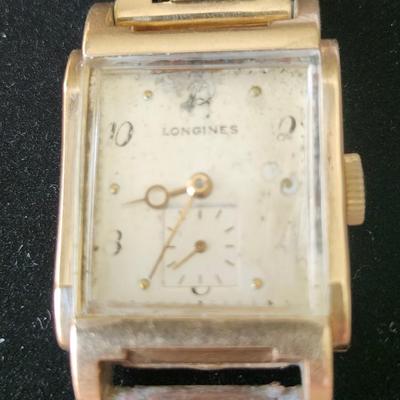 Sale Photo Thumbnail #248: Longines & Wittnauer Watch Co. Inc.  New York Geneva Montreal
K & L 14 K gold  case # 762857     Timepiece # 7314052
17 jewels    9 L    1947 manufacture
Mechanical manual set / wind.   It is working
It obviously has some wear and needs a good cleaning,  