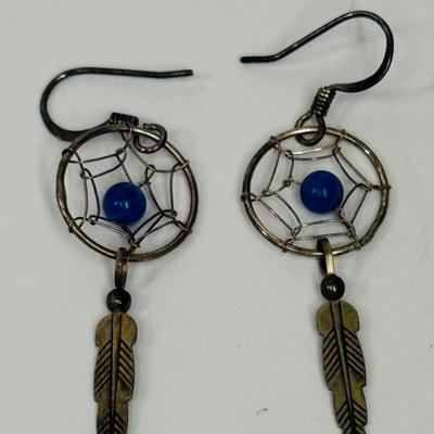 Sale Photo Thumbnail #15: Silver-tome with blue stone in the center of the dreamcatcher. Good condition.