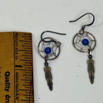 Sale Photo Thumbnail #16: Silver-tome with blue stone in the center of the dreamcatcher. Good condition.