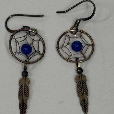 Sale Photo Thumbnail #14: Silver-tome with blue stone in the center of the dreamcatcher. Good condition.