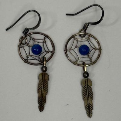 Sale Photo Thumbnail #12: Silver-tome with blue stone in the center of the dreamcatcher. Good condition.