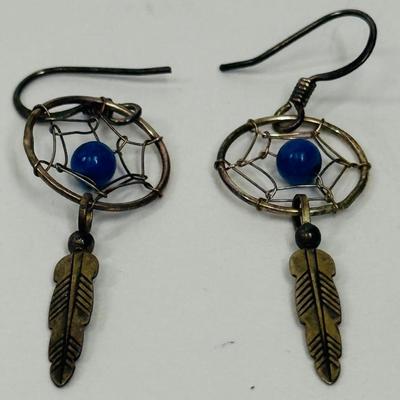 Sale Photo Thumbnail #13: Silver-tome with blue stone in the center of the dreamcatcher. Good condition.