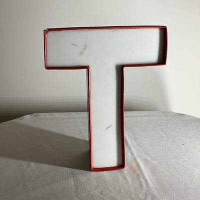T White Sign