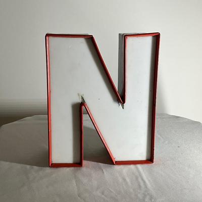 N White Sign
