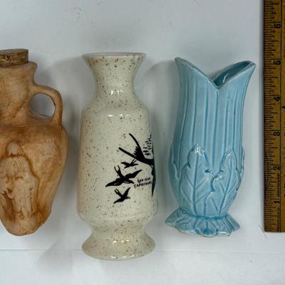 Sale Photo Thumbnail #571: San Juan Capistrano souvenir vase with small chips on top edge
Powder Blue vase with cracks and chip on top
Reddish Brown urn with stopper has no damage