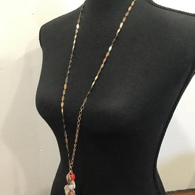 Very nice gold toned fashion, tassel charm necklace