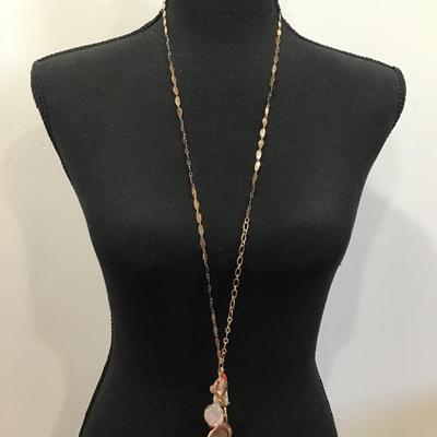 Very nice gold toned fashion, tassel charm necklace