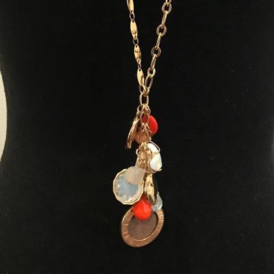 Very nice gold toned fashion, tassel charm necklace