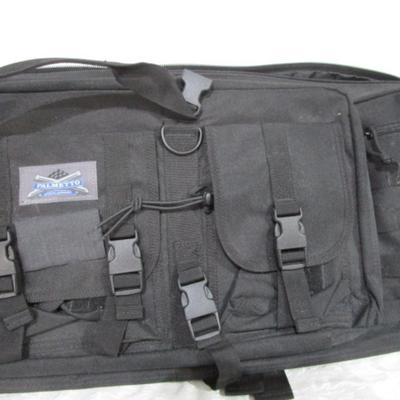 Sale Photo Thumbnail #251: Has backpack straps and 5 smaller pockets, 1 larger zipper pocket, & zippered area for the rifle, 36" long x 12" wide x 3" deep, See pictures