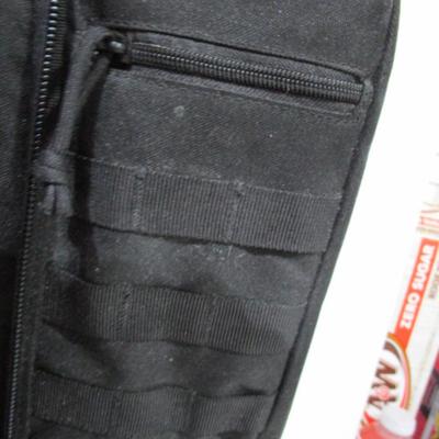 Sale Photo Thumbnail #256: Has backpack straps and 5 smaller pockets, 1 larger zipper pocket, & zippered area for the rifle, 36" long x 12" wide x 3" deep, See pictures