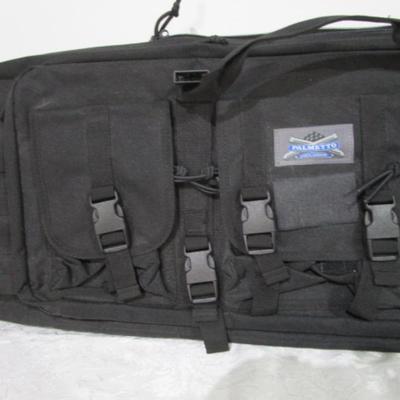 Sale Photo Thumbnail #250: Has backpack straps and 5 smaller pockets, 1 larger zipper pocket, & zippered area for the rifle, 36" long x 12" wide x 3" deep, See pictures