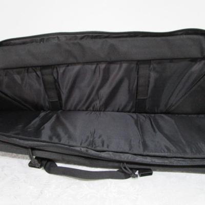 Sale Photo Thumbnail #254: Has backpack straps and 5 smaller pockets, 1 larger zipper pocket, & zippered area for the rifle, 36" long x 12" wide x 3" deep, See pictures
