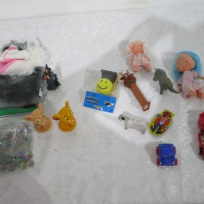 Sale Photo Thumbnail #281: Transformer car, small car , animals, 2 dolls, Lion King figures, marbles, hand puppet, etc