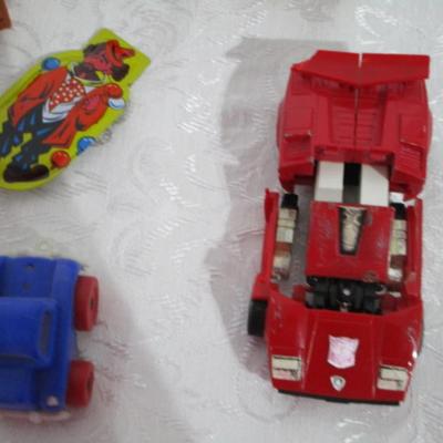 Sale Photo Thumbnail #282: Transformer car, small car , animals, 2 dolls, Lion King figures, marbles, hand puppet, etc