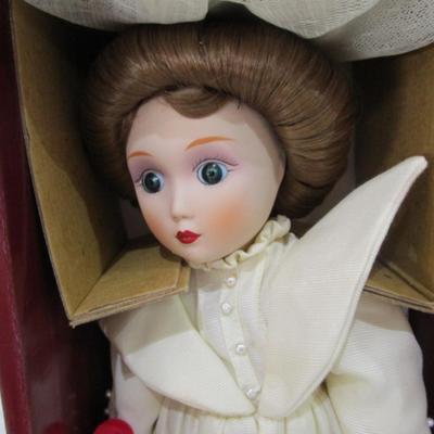 Sale Photo Thumbnail #373: New in box, porcelain doll includes stand, 13" tall