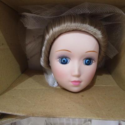 Sale Photo Thumbnail #376: New in box, porcelain doll includes stand, 13" tall