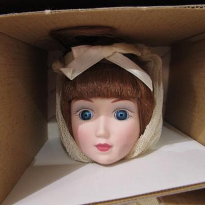 Sale Photo Thumbnail #380: New in box, porcelain doll includes stand, 13" tall