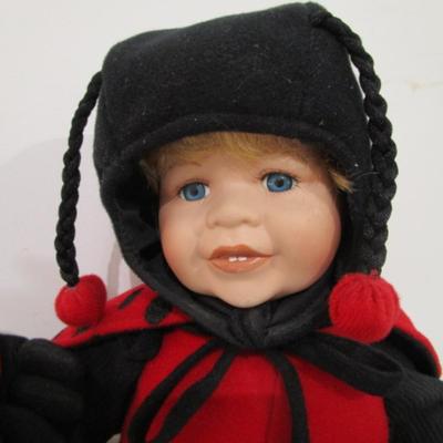 Sale Photo Thumbnail #390: Hands & face are porcelain, doll is 15" tall