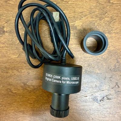 Sale Photo Thumbnail #584: Model DCM35. This camera is perfect for medical and lab equipment, devices, and applications. With a magnification range of 350K pixels, you can get high-quality images of your microscope specimens. The camera is made in Japan and comes with an extra lens