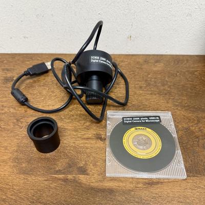 Sale Photo Thumbnail #582: Model DCM35. This camera is perfect for medical and lab equipment, devices, and applications. With a magnification range of 350K pixels, you can get high-quality images of your microscope specimens. The camera is made in Japan and comes with an extra lens