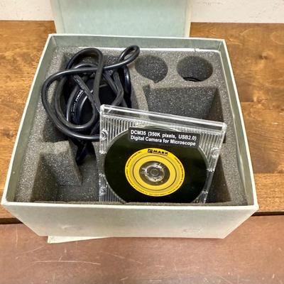 Sale Photo Thumbnail #581: Model DCM35. This camera is perfect for medical and lab equipment, devices, and applications. With a magnification range of 350K pixels, you can get high-quality images of your microscope specimens. The camera is made in Japan and comes with an extra lens