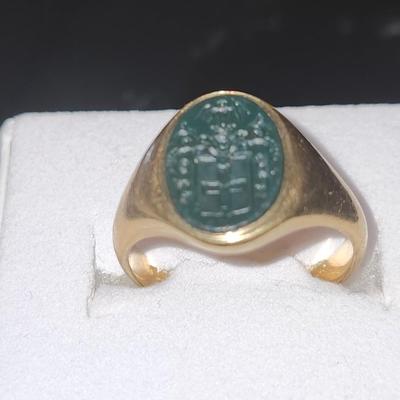 Sale Photo Thumbnail #291: Carved in black tourmaline, the ring is 10K gold.  
Size 7
