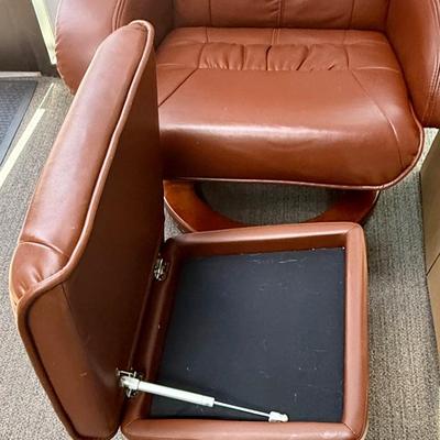 Sale Photo Thumbnail #591: Recliner chair and matching ottoman.  Good overall condition, some tiny spots in a few places on the material, not noticeable from a distance. Product details:
Color: Caramel Brown
Item dimensions (L x W x H): 42 x 30 x 40 inches
Material: Faux Leather, W