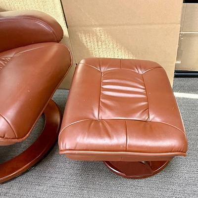 Sale Photo Thumbnail #595: Recliner chair and matching ottoman.  Good overall condition, some tiny spots in a few places on the material, not noticeable from a distance. Product details:
Color: Caramel Brown
Item dimensions (L x W x H): 42 x 30 x 40 inches
Material: Faux Leather, W