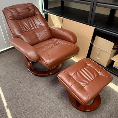 Sale Photo Thumbnail #587: Recliner chair and matching ottoman.  Good overall condition, some tiny spots in a few places on the material, not noticeable from a distance. Product details:
Color: Caramel Brown
Item dimensions (L x W x H): 42 x 30 x 40 inches
Material: Faux Leather, W