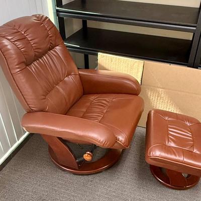 Sale Photo Thumbnail #597: Recliner chair and matching ottoman.  Good overall condition, some tiny spots in a few places on the material, not noticeable from a distance. Product details:
Color: Caramel Brown
Item dimensions (L x W x H): 42 x 30 x 40 inches
Material: Faux Leather, W