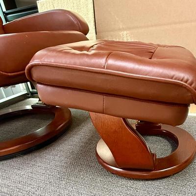 Sale Photo Thumbnail #593: Recliner chair and matching ottoman.  Good overall condition, some tiny spots in a few places on the material, not noticeable from a distance. Product details:
Color: Caramel Brown
Item dimensions (L x W x H): 42 x 30 x 40 inches
Material: Faux Leather, W