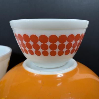 LOT 273: Pyrex Mixing Bowls: Pink Candy Stripe, New Dots (Orange), New Dots (Yellow), Daisey Cinderella