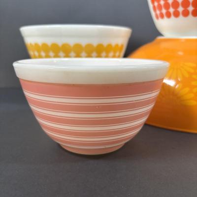LOT 273: Pyrex Mixing Bowls: Pink Candy Stripe, New Dots (Orange), New Dots (Yellow), Daisey Cinderella