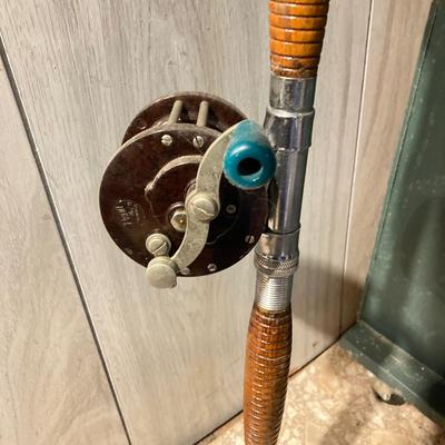 LOT 309: Set of (2) Wooden Fishing Poles with Penn Reels No 35 and No 79 & Wicker Fishing Creel