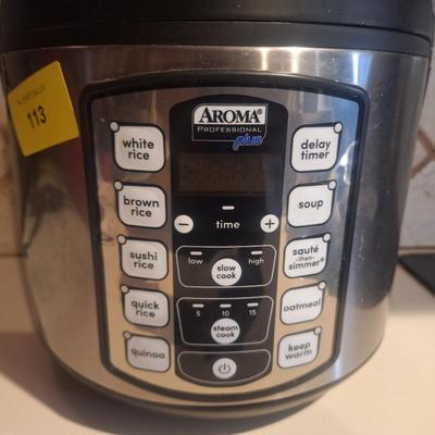 Sale Photo Thumbnail #21: Rice cooker, clean and working.has a small dent- see just under where the auction sticker is.
