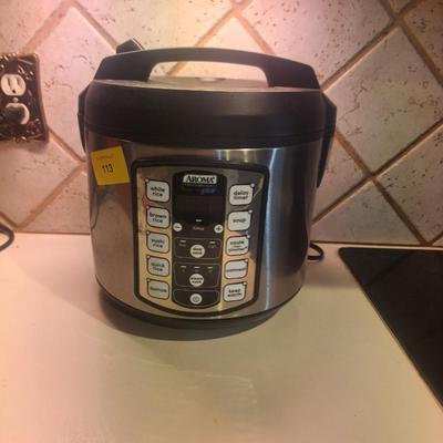 Sale Photo Thumbnail #20: Rice cooker, clean and working.has a small dent- see just under where the auction sticker is.